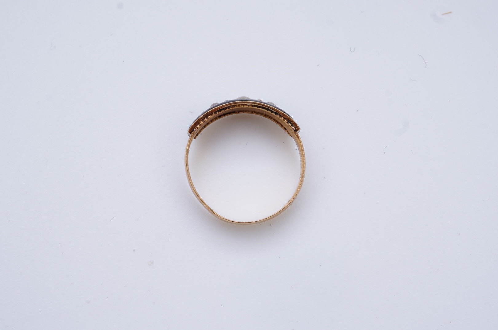 A Victorian black enamel and pearl mourning ring, 19th century